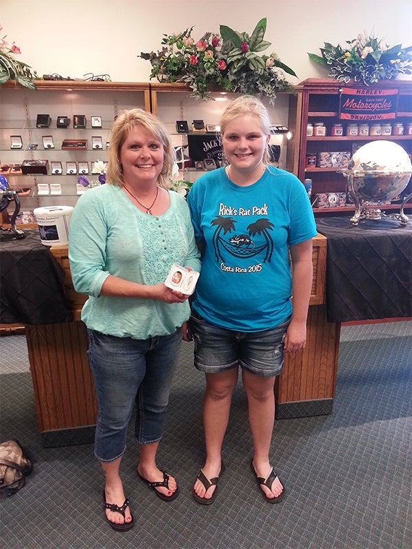 Nancy and Desirae Heideman hold their pendants for being one of the Mothers Day photo contest winners. — Provided