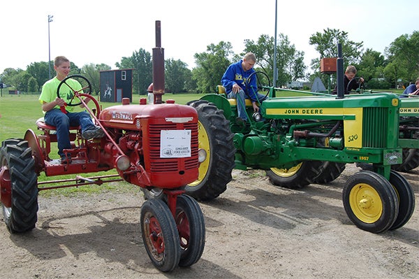 Jacob Songstad, Isaac Sorensen and Ryan Hansen were just three of the Alden-Conger students who participated in Tractor Day. — Shelly Zeller/Alden Advance