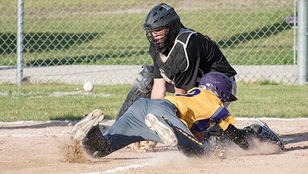 Cael Boehmer of Lake Mills dives home Tuesday during a doubleheader against Osage at Lake Mills.  — Lory Groe/For the Albert Lea Tribune