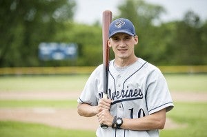 Lucas Knutson holds a bat on May 29 at the Glenville-Emmons baseball field. Knutson played baseball at the high school and collegiate levels. - Micah Bader/Albert Lea Tribune