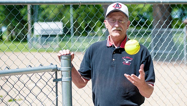 Gary Nelson stands along the fence Thursday at the Alden-Conger softball field at Alden. Nelson coached the Knights’ softball team for 28 years and retired at the end of the season. — Micah Bader/Albert Lea Tribune