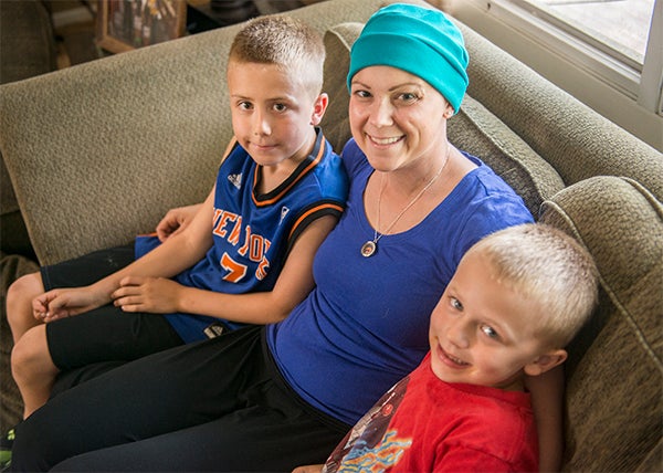 Erin Mikels, pictured with sons Trenton, left, and Jayson, right, was diagnosed with breast cancer on April 2. Mikels, 31, is currently going through chemotherapy and said she has a double mastectomy scheduled for November. — Colleen Harrison/Albert Lea Tribune