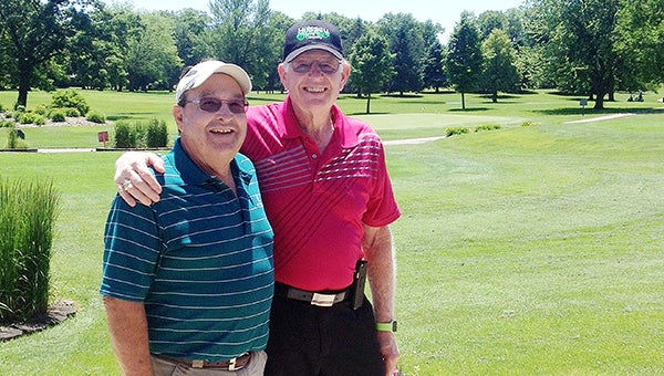 Dan Hussey, right, hit a hole-in-1 on the 14th hole from the 163-yard blue tees with a five iron Tuesday at Rice Lake Golf & Country Club. His witness, Mick Keyser stands left. — Provided