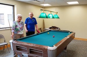 The new lounge in the wellness center is a popular place to be. Residents enjoy a game of pool. - Provided