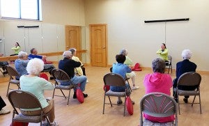 Thorne Crest residents participate in chair exercises in part of the new wellness center. - Provided