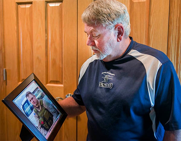 Don Goodnature holds a photo of his son, Corey Goodnature. Warrant Officer Corey Goodnature was one of 16 killed when his company’s MH-47 Chinook helicopter was shot down June 28, 2005, in Afghanistan while attempting to rescue missing U.S. Navy SEALs. — Colleen Harrison/Albert Lea Tribune
