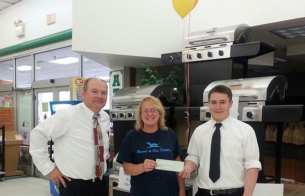 Marketplace Foods raised $1362 for the Freeborn County Humane Society doing donations at the register and giving people a paw print to put their names on. Pictured are Store Manager Casey Connor, Shelter Manager Christa DeBoer and Jake Weitzel, the store employee who collected the most donations. - Provided