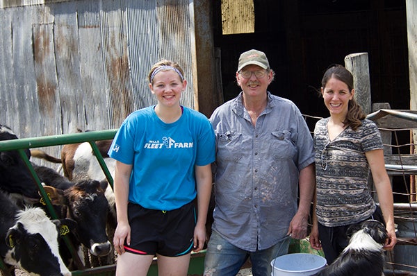 Rachel Wangen, Matt Wangen and Mary Wangen stand in front of some of their dairy cows at their farm in Twin Lakes. - Sam Wilmes/Albert Lea Tribune