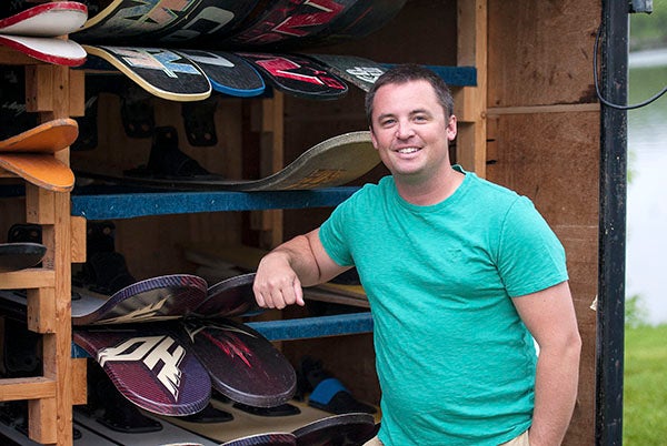 Matt Levorson, president of the Bayside Ski Team in Albert Lea, stands next to the trailer that houses supplies for the team, including skis.