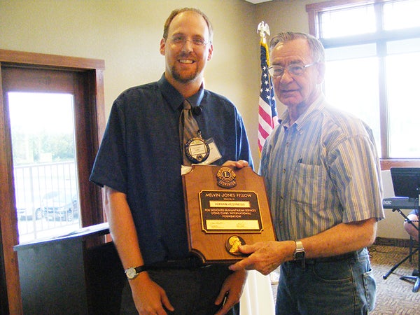Albert Lea Lions President Eric Youlden presents Lion Adrian Hestness with the Melvin Jones Fellow Award for his many years of service. Hestness has been a Lion for 49 years.  -Provided