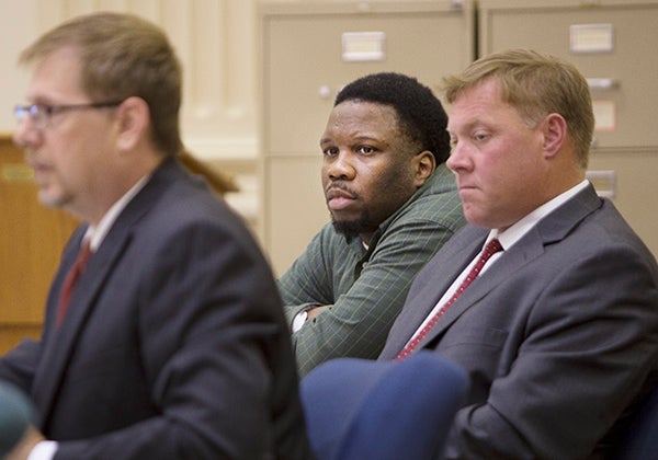 Tyrone Washington Jr. watches as a knife found at the scene of Justina Smith’s death is showed to a jury and entered into evidence during his trial Thursday in Fort Dodge, Iowa. Washington is charged in the August 2013 stabbing of ex-girlfriend Smith in Swensrud Park in Northwood. - Colleen Harrison/Albert Lea Tribune