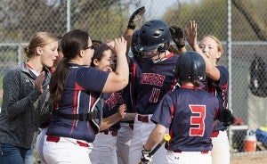 Kassi Hardies of Albert Lea is congratulated by teammates after hitting a solo home run in the bottom of the fifth inning on April 28 against Faribault at Hammer Field. — Micah Bader/Albert Lea Tribune