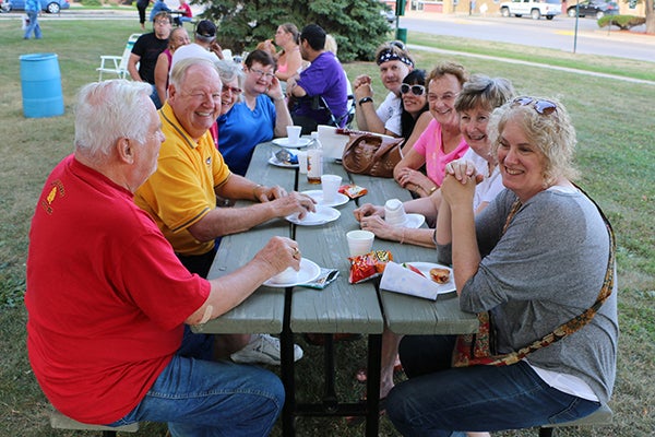 Residents enjoy a previous year’s neighborhood picnic. - Provided