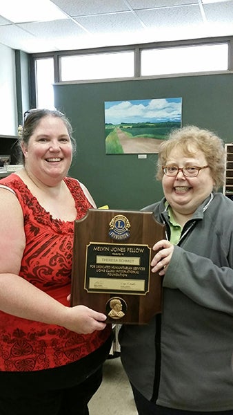 Albert Lea Lions Vice President Tammy Krowiorz presents Lion Theresa Schmidt with the Melvin Jones Fellowship Award for Service. Schmidt has been a member of the Albert Lea Lions for 15 years. - Provided