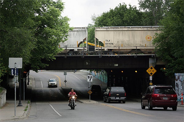 The railroad bridge over 15th Avenue near Dinkytown in Minneapolis has been hit by vehicles several times and shows signs of extensive deterioration, bridge inspectors say. Jeffrey Thompson/MPR News