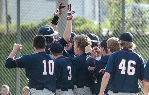 Chris Enderson of Albert Lea celebrates at home plate with his teammates after hitting a two-run walk-off home run in the bottom of the seventh inning to complete a six unanswered-run rally on May 7 against Mankato East at Hayek Field. — Micah Bader/Albert Lea Tribune