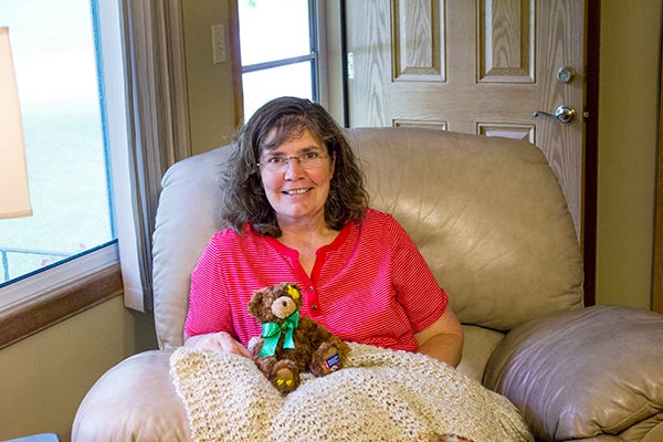 Monica Nelson received a prayer blanket from her church during her cancer treatment. “To this day it is still the blanket we fight over,” Nelson said. - Madeline Funk/Albert Lea Tribune