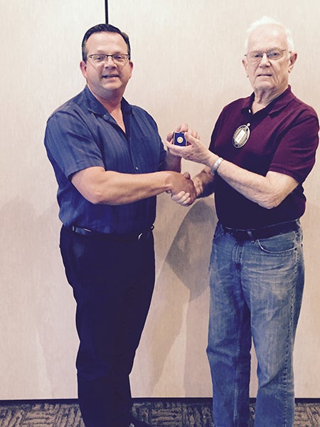 Albert Lea Rotary President Garry Hart presents Bill Groskurth with the Paul Harris Fellowship Award. -Provided