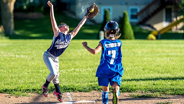 Phoebe Holst of the Albert Lea U10 Red softball team catches a throw to first base Wednesday against Dover-Eyota White at Southwest Fields. Albert Lea completed its third consecutive doubleheader sweep with 12-1 and 3-0 wins over Dover-Eyota. Albert Lea ended the regular season with a 10-4-2 record and will play its season-ending tournament Aug. 8 at Kasson. — Buck Monson/For the Albert Lea Tribune