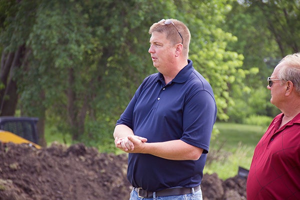 Troy Schrom of Schrom Construction speaks on Tuesday at the groundbreaking for the new Wedgewood Cove Townhomes.  - Elena Schewe/Albert Lea  Tribune
