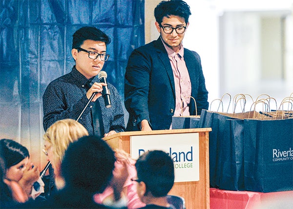 David Garcia, of Austin, talks about his experience with Be Your Best with Juan Fernando Rodriguez during a ceremony Thursday night at Riverland Community College. — Eric Johnson/Albert Lea Tribune
