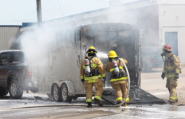 Albert Lea Fire Department firefighters douse a fire in a trailer hauled by a pickup in front of UPS, 707 E. 12th St. Supervisor Cory Shea said the maintenance worker who does work for the company was showing him something on the business’s conveyor belt when they heard a pop and the fire started. The pickup and trailer, belonging to the worker, had been parked in the parking lot near building and a UPS trailer, but the worker got in the truck and moved them to the street as a precautionary measure. No packages transported by UPS were affected as a result of the fire. The cause has not been determined. -Sarah Stultz/Albert Lea Tribune