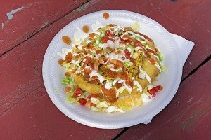 The Indian Taco consisted of optional vegetable toppings, cheese, taco sauce and sour cream. - Madeline Funk/Albert Lea Tribune