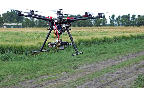 University of Minnesota researchers are using drones for a variety of agriculture-related research. This drone uses a camera to collect images that help researchers see plants stressed by disease or insect infestation on the Crookston campus on July 27. - Dan Gunderson/MPR News