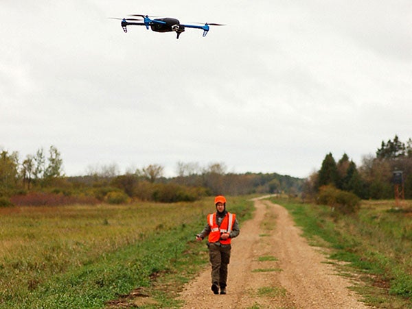 Mark Ditmer watched the successful landing of a drone after a mission involving flying over a bear foraging in a cornfield in northwestern Minnesota on Oct. 4, 2014. — Photo courtesy Jessie Tanner 2014