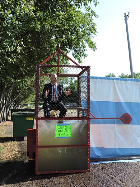 United South Central Superintendent Jerry Jensen was the first to volunteer for the Communities Fighting Student Hunger dunk tank on Friday. His own secretary, Deb Lackey, was just one of many to successfully dunk him. - Kelly Wassenberg/Albert Lea Tribune