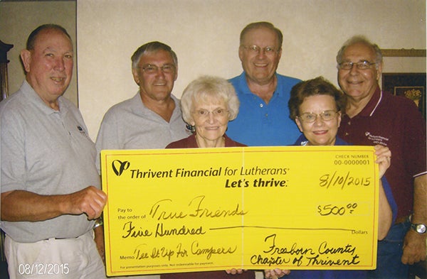 Freeborn County Chapter of Thrivent board members Joyce Fredin, Candace Pierce, Gary Hunnicutt and David Olson present a supplemental funding check of $500 to Jim Beach and Al Jensen for the Tee it Up for Campers fundraiser, which was on July 11. - Provided