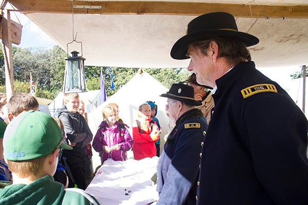 Re-enactors describe historical events to students during the Big Island Rendezvous Education Days at Bancroft Bay Park. The Rendezvous will be open to the public Saturday and Sunday. -Sam Wilmes/Albert Lea Tribune
