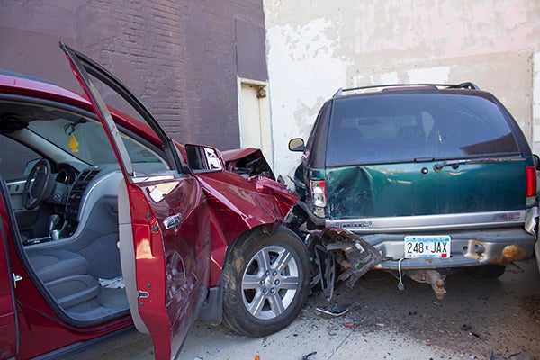 A Chevrolet Traverse and GMC Jimmy collided Friday afternoon in a parking lot north of the Knutson Building. - Sam Wilmes/Albert Lea Tribune 