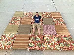 Colin Laurie poses with the 20 dog beds he constructed and then donated to the Humane Society of Freeborn County. - Provided