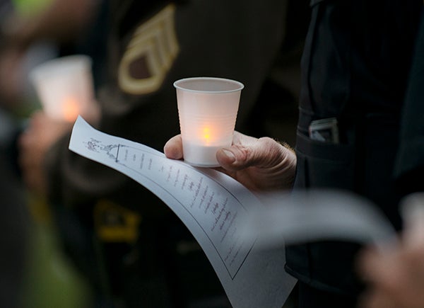 Members of the community gathered Thursday night in New Denmark Park for a domestic violence awareness community candlelight vigil. October is Domestic Violence Awareness Month. - Colleen Harrison/Albert Lea Tribune