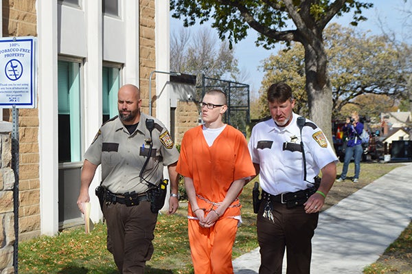 Waseca County sheriff’s deputies lead John David LaDue away from the Waseca County courthouse toward the jail following sentencing on one count of possession of explosives.  - Jacob Stark/Waseca County news 
