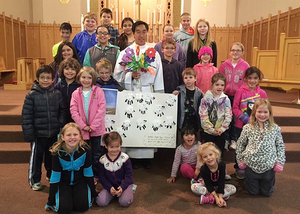 The students of St. Casimir’s School in Wells recently honored their pastor, the Rev. Andrew Vogel, in celebration of National Pastor Appreciation Day, which was celebrated on Oct. 11.The older students presented Vogel with a spiritual bouquet in which each student created a flower and wrote a blessing for him on it. The younger students had created a poster in which they each made a sheep from cotton balls and cutout of their hand to follow the theme of the sheep and the good shepherd. -Provided