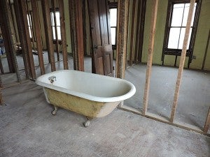 Old fixtures, including two clawfoot bathtubs and doors, are being saved in hopes of being restored and reused in the building project for the New Richland Area Food Shelf and New Richland Area Historical Society. - Kelly Wassenberg/Albert Lea Tribune