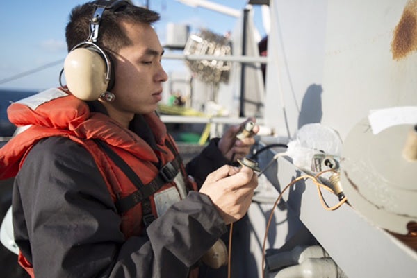 Seaman Paisith Sengsouriya of from Austin assembles a phone-and-distance line aboard the U.S. Navy’s only forward-deployed aircraft carrier, USS Ronald Reagan, during a fueling-at-sea with the Ticonderoga-class guided-missile cruiser USS Chancellorsville. Ronald Reagan and its embarked air wing, Carrier Air Wing 5, provide a combat-ready force that protects and defends the collective maritime interests of the United States and its allies and partners in the Indo-Asia-Pacific region. -U.S. Navy photo