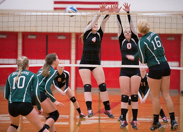 Alden-Conger's Elynn Johnson, left, and Madison Erickson attempt to block during Monday's match against Waterville-Elysian-Morristown during the Section 2A quarterfinals at Mankato West. - Colleen Harrison/Albert Lea Tribune