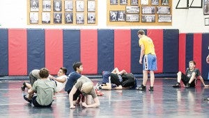Albert Lea wrestlers participate in a captain’s practice in the wrestling room at Albert Lea High School. The first official practice of the year will be Nov. 16. - Micah Bader/Albert Lea Tribune