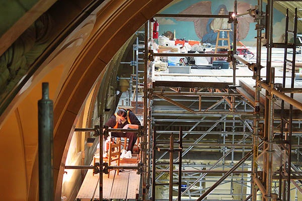 An art restorer works near the top of the Minnesota State Capitol’s east wing Monday. The Capitol is expected to remain closed until 2017, though the state House plans to return to session in March. -Tim Pugmire/MPR News