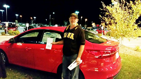 Don Peterson poses with the 2015 Ford Focus he won on Halloween from Diamond Jo’s Casino in Northwood. - Provided