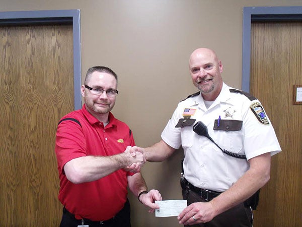Stateline Safety Council Vice President Quentin Sickels presents a donation from the council to Freeborn County Sheriff Kurt Freitag. Sickels and Freitag presented training on workplace violence to Stateline Safety Council members. The safety council is a group of local businesses from southern Minnesota and northern Iowa. The group meets monthly to do onsite visits and lectures about current safety topics and trends. Members and nonmembers are welcome to attend. For membership or training information contact council President LaVerne Schroeder at 507-377-5317 or Sickels at 641-591-2116. -Provided 