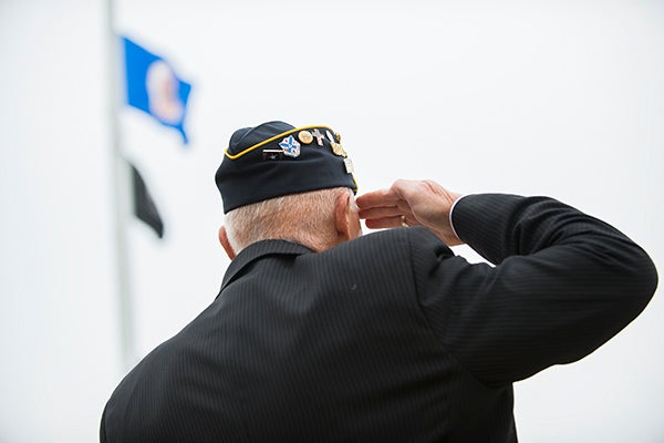 A veteran salutes as the U.S. flag is raised Wednesday morning during a Veterans Day ceremony in front of Freeborn County Courthouse. - Colleen Harrison/Albert Lea Tribune