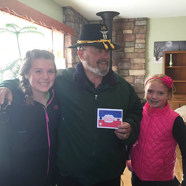 Shelby and Marissa Hanson from Girl Scout Troop No. 43224 deliver a Veterans Day card to Larry King. The girls will host a dining to donate fundraiser at Applebee’s in Albert Lea to fund a Girl Scout project they have created called Cookies For Vets. The fundraiser is from 4 to 9 p.m. Nov. 24. The public is invited to attend. -Provided