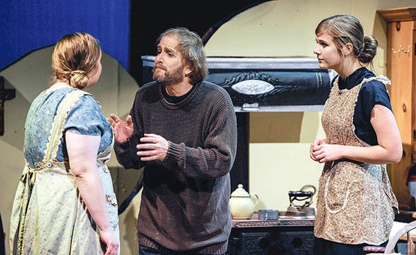 James Zschunke, playing the part of Jack, rehearses a scene Tuesday night of “Dancing at Lughnasa” with Katelyn Larson playing Maggie, left, and Claire Olson playing Kate. - Eric Johnson/Albert Lea Tribune