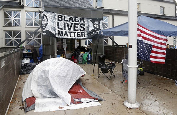 Members of Black Lives Matter continued their encampment Tuesday outside the Minneapolis Police Department’s 4th Precinct. Police moved to retake the entranceway into the Fourth Precinct from protesters Wednesday afternoon.  -Jim Mone/AP