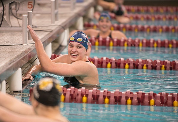 Albert Lea's Lindsey Horejsi pauses to celebrate after breaking the national high school record in the 100-yard breaststroke with a time of 58.56 seconds Thursday in the girls’ Class A state swimming prelims at the University of Minnesota Aquatic Center. - Colleen Harrison/Albert Lea Tribune