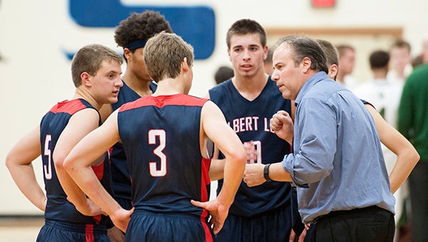 Albert Lea coach Stan Thompson instructs his players during a timeout Tuesday against Rochester Mayo at Albert Lea. — Micah Bader/Albert Lea Tribune